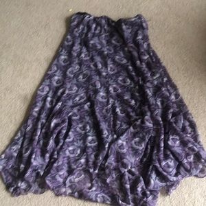 This a flowy skirt with a purple floral pattern.